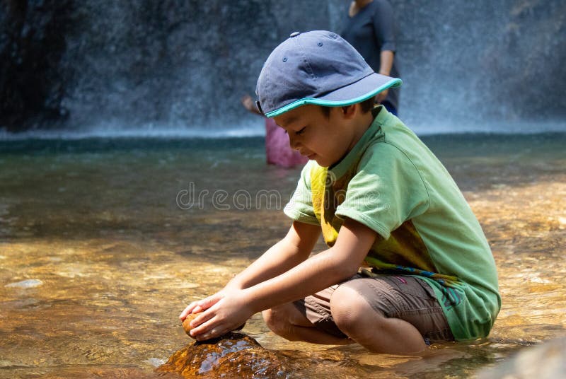 The boys were playing on the rocks and enjoy the Chok Kra-DinÂ WaterFalls.